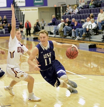 Austin grad Zach Wessels handles the ball for the University of Sioux Falls men’s basketball team this season. Photo by Gene Smith
