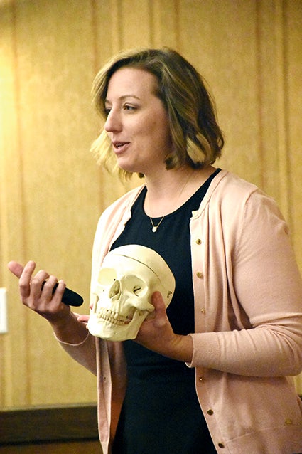 Elena Haymond discusses a point of bone analysis during the talk, "The Archaelogy of Bones" on Monday night at the Hormel HIstoric Home, part of its Happy History Hour series. 