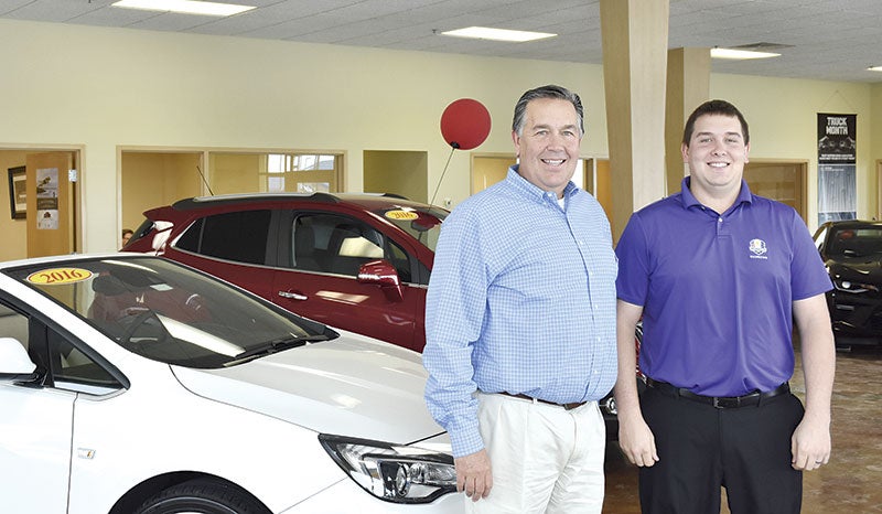 Todd Asa and his son, Tanner, posed for a photo at Asa Auto Plaza Austin in Austin, formerly Usem Inc. Todd purchased Usem from the Sherman family, which owned it for more than 90 years. Tanner will serve as general manager. Jason Schoonover/jason.schoonover@austindailyherald.com