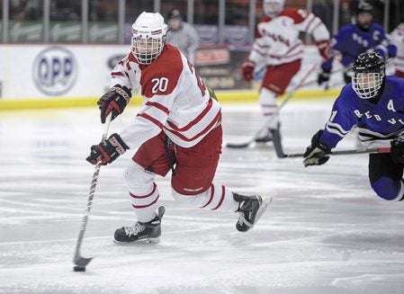 Austin’s Brayden Merritt turns with the puck during the second period against Red Wing Thursday night in Riverside Arena. Eric Johnson/photodesk@austindailyherald.com