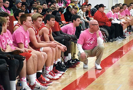 Austin head coach Kris Fadness looks on during the action against Mankato West on Paint the Gym Pink Night in Packer Gym Monday. 