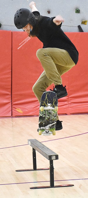 Evan Breder flies over a bar in demonstration of skateboarding — and science.