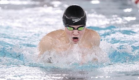 Austin’s Trey Myers siwmming the breastroke in the 200 medley relay against Rochester Mayo Thursday night in Bud Higgins Pool. Eric Johnson/photodesk@austindailyherald.com
