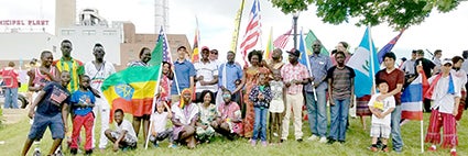 Many people from Austin’s diverse community pose for a photo before the Fourth of July parade in Austin. Photo provided