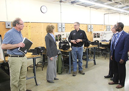 Riverland Community College officials led Lt. Gov. Tina Smith and other state officials on a tour of the college before Smith announced a new goal for a renewable energy standard on Monday. Sarah Stultz/Albert Lea Tribune