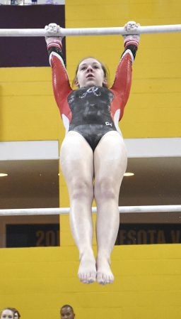 Jordan DeLaMater performs on the bars during the Minnesota Class A State Gymnastics Meet Friday at the University of Minnesota’s Sports Pavillion. Rocky Hulne/sports@austindailyherald.com