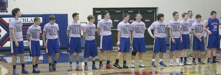The Southland boys basketball team wears their shirts in honor of Dover-Eyota’s Kale Pike in Adams Tuesday night. Photo by Matthew Schneider/Mower County Independent
