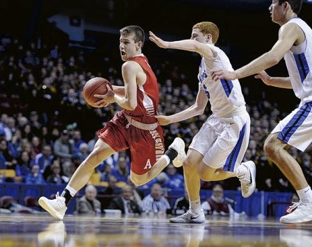 Austin’s Tate Hebrink finds room in the lane during the second half against St. Thomas Academy in the Minnesota Class AAA Boys State Basketball Tournament quarterfinals Wednesday in the University of Minnesota’s Williams Arena. Eric Johnson/photodesk@austindailyherald.com