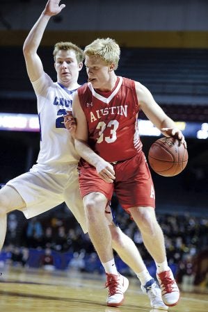Austin’s Kyle Oberbroeckling pushes to the hoop in the second half against the quarterfinals in the Minnesota Class AAA Boys State Basketball Tournament Wednesday in the University of Minnesota’s Williams Arena. Eric Johnson/photodesk@austindailyherald.com