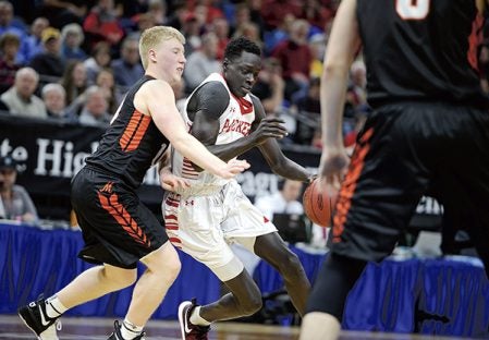Austin’s Both Gach looks for room to move against the Marshall defense in the first half in the semifinals of the Minnesota Class AAA Boys State Basketball Tournament Thursday at Target Center in Minneapolis. Eric Johnson/photodesk@austindailyherald.clom