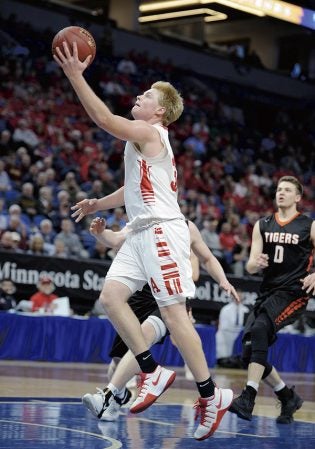 Austin’s Kyle Oberbroeckling gets a layup in the first half against Marshall in the semifinals of the Minnesota Class AAA Boys State Basketball Tournament Thursday at Target Center in Minneapolis. Eric Johnson/photodesk@austindailyherald.clom
