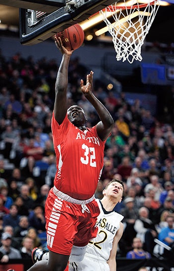 Austin’s Oman Oman gets a layup in the second half against DeLaSalle in the Class AAA Minnesota State Boys Basketball Tournament championship Saturday night at Target Center. 