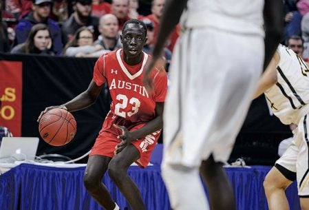 Austin’s Duoth Gach works around the perimeter during the first half against DeLaSalle in the Class AAA Minnesota State Boys Basketball Tournament championship Saturday night at Target Center. Eric Johnson/photodesk@austindailyherald.com