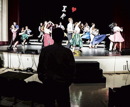 Director Brian Johnson watches the opening number during rehearsal Wednesday night for the Austinaires spring show in Christgau Hall. Eric Johnson/photodesk@austindailyherald.com